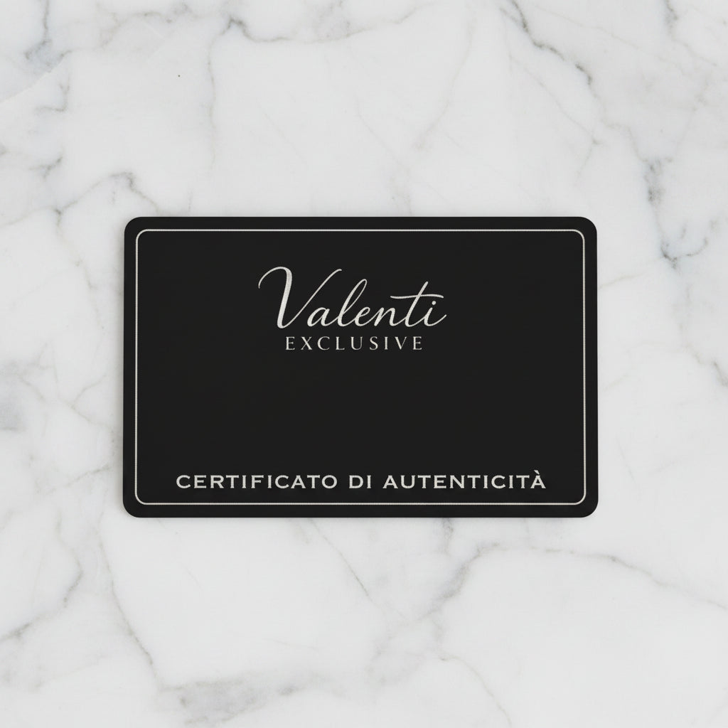 Black card with 'Valenti Exclusive' and 'Certificato di Autenticità' text on a marble background